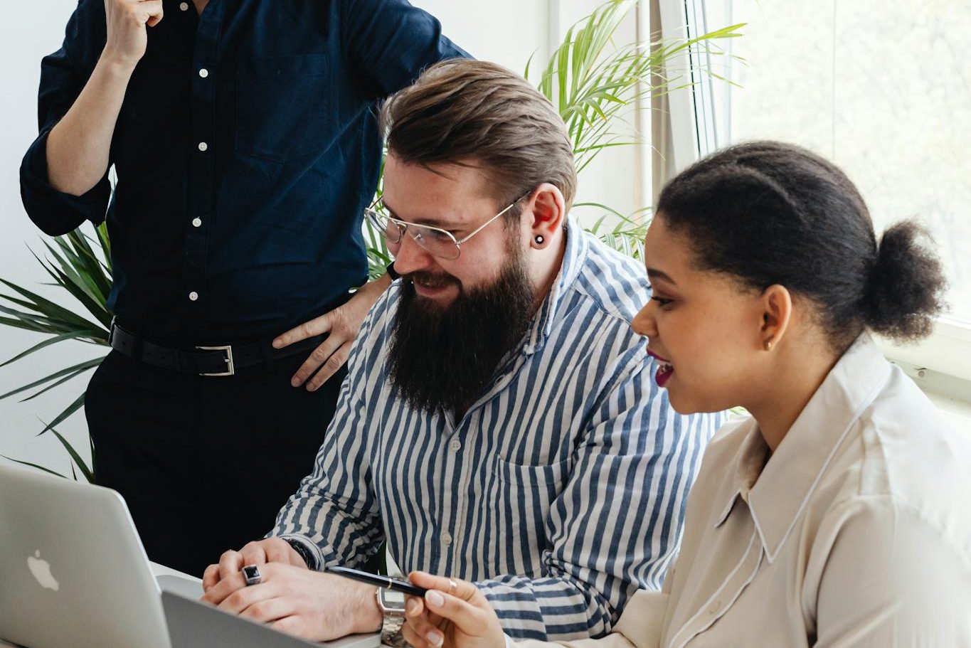 Man in Blue Long Sleeve Shirt Talking on the Phone